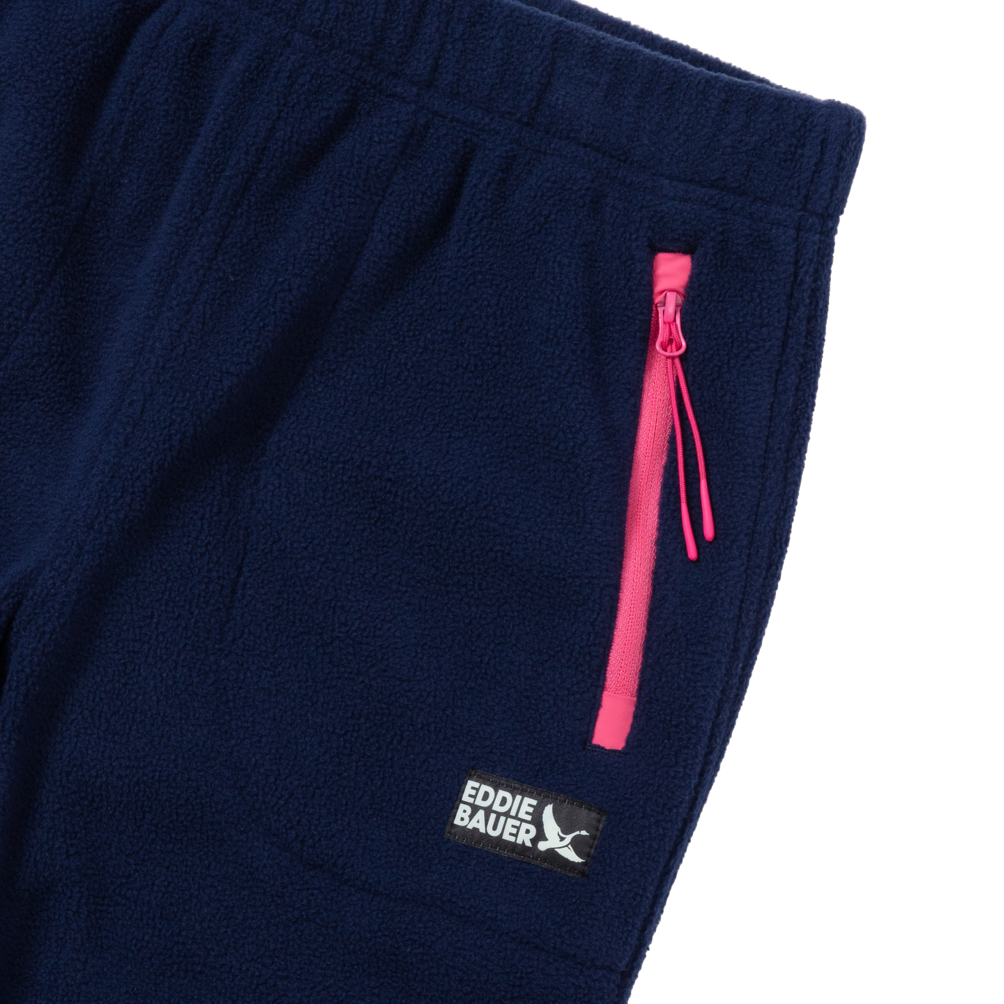 Navy fleece jogger with pink zip pocket and Eddie Bauer logo on leg.