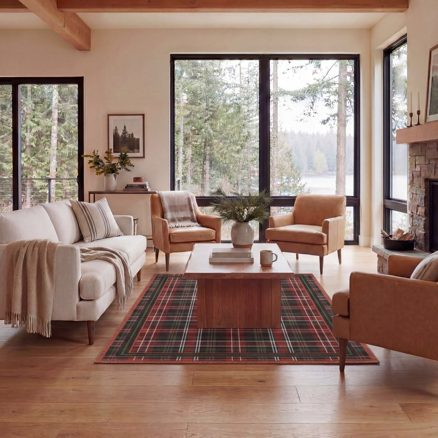 Living room with plaid rug, wooden coffee table, and large windows overlooking trees.