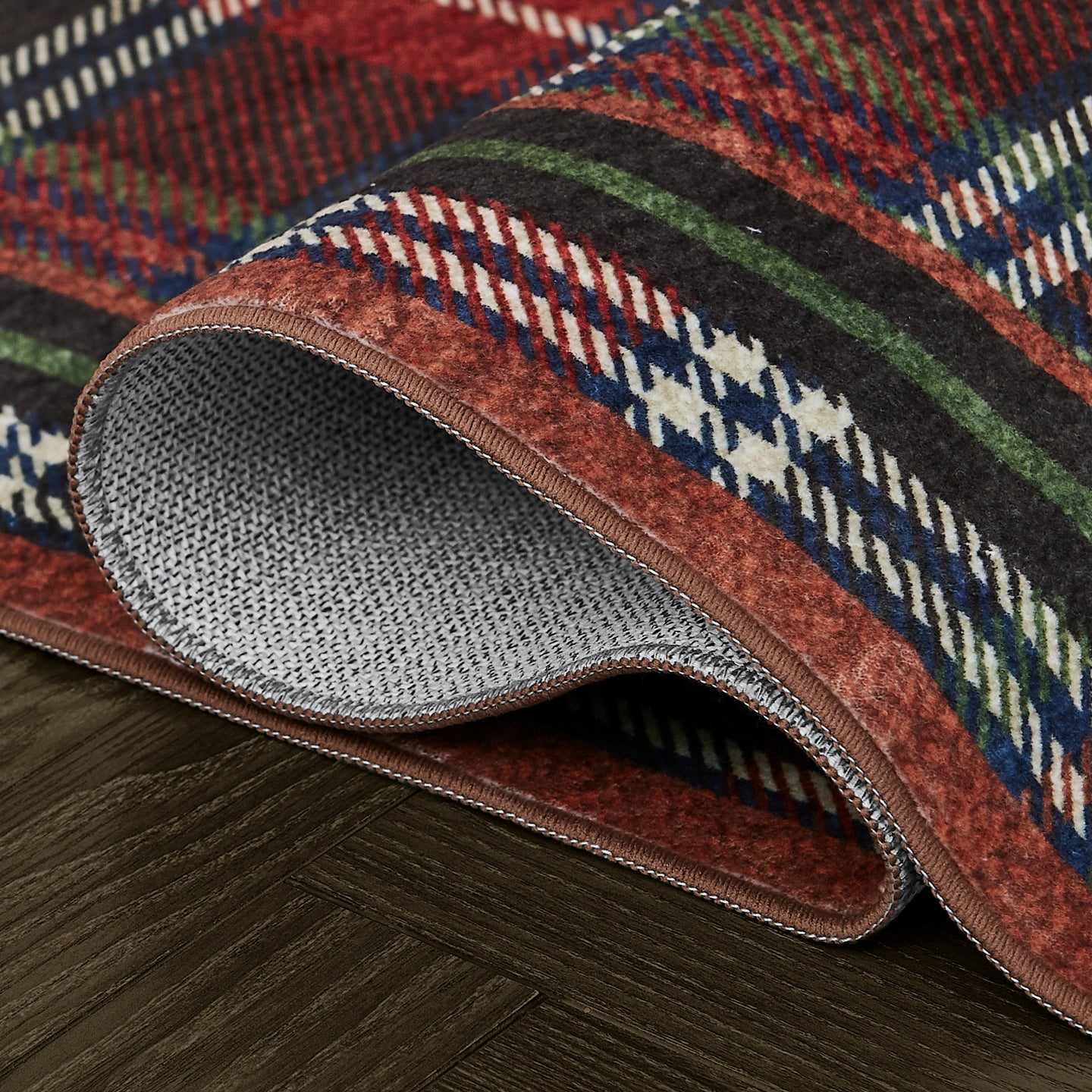 Close-up of a patterned rug on a wooden floor