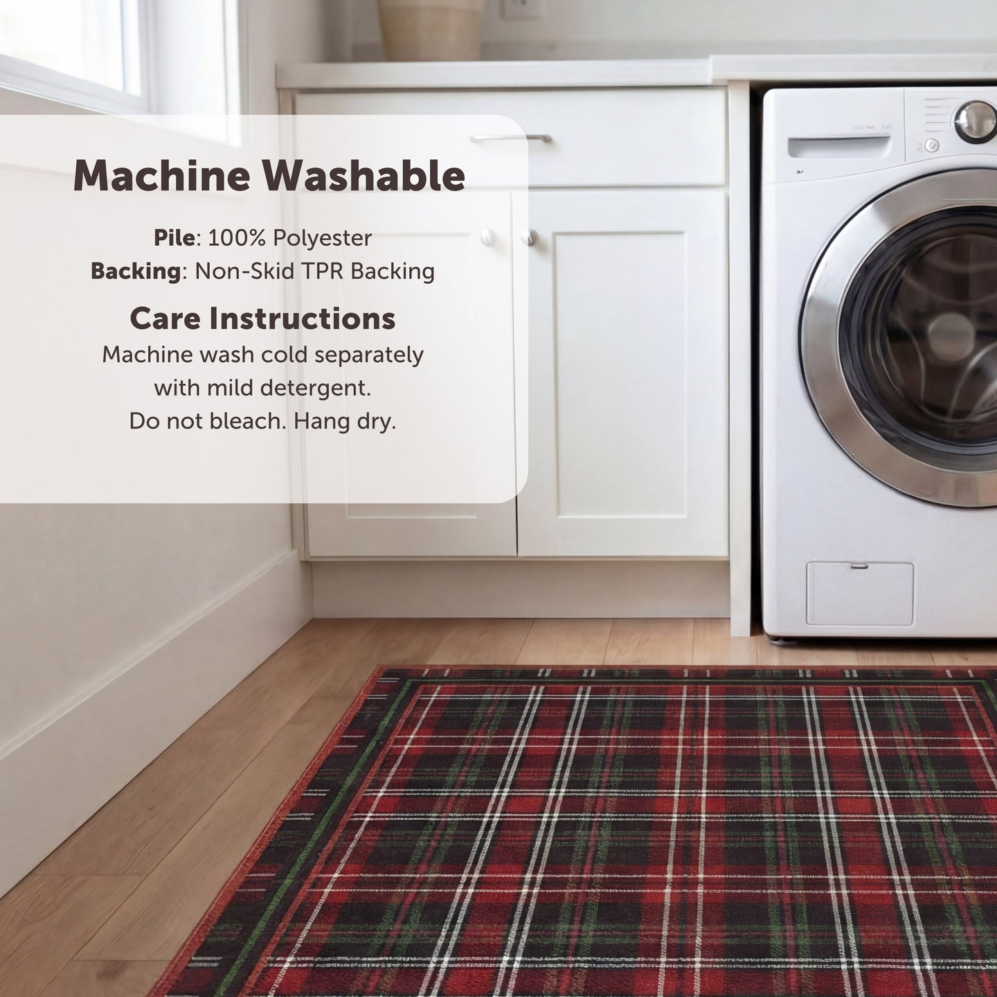 Red plaid rug on a wooden floor with washing machine and cabinets in the background