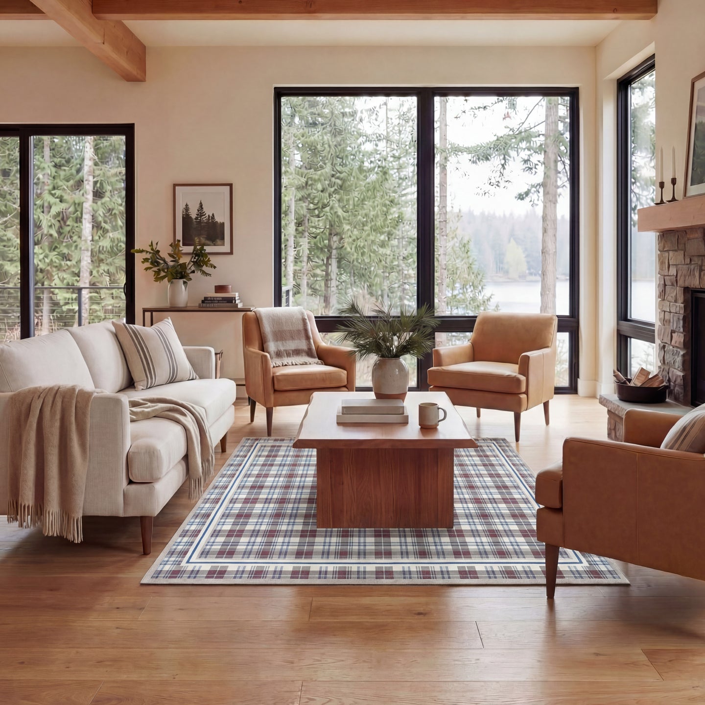 Cozy living room with beige sofa, brown armchairs, and wooden coffee table in a home with large windows.