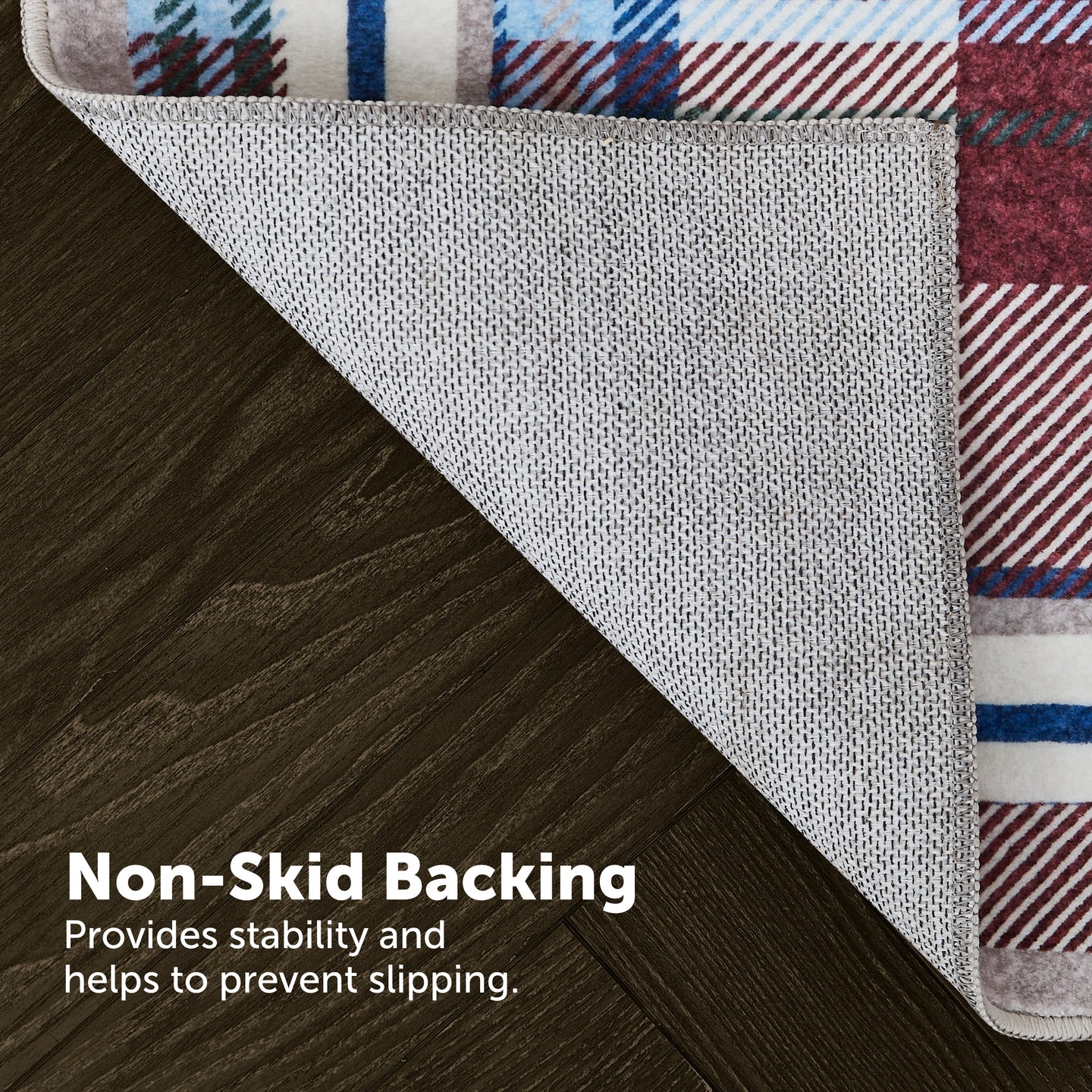 Close-up of a rug with non-skid backing on a wooden floor.
