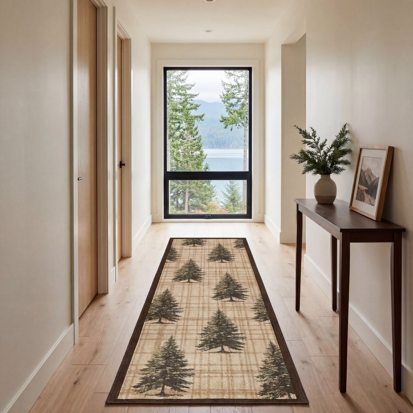 Beige runner rug with dark pine tree pattern and brown border on light wood hallway floor.