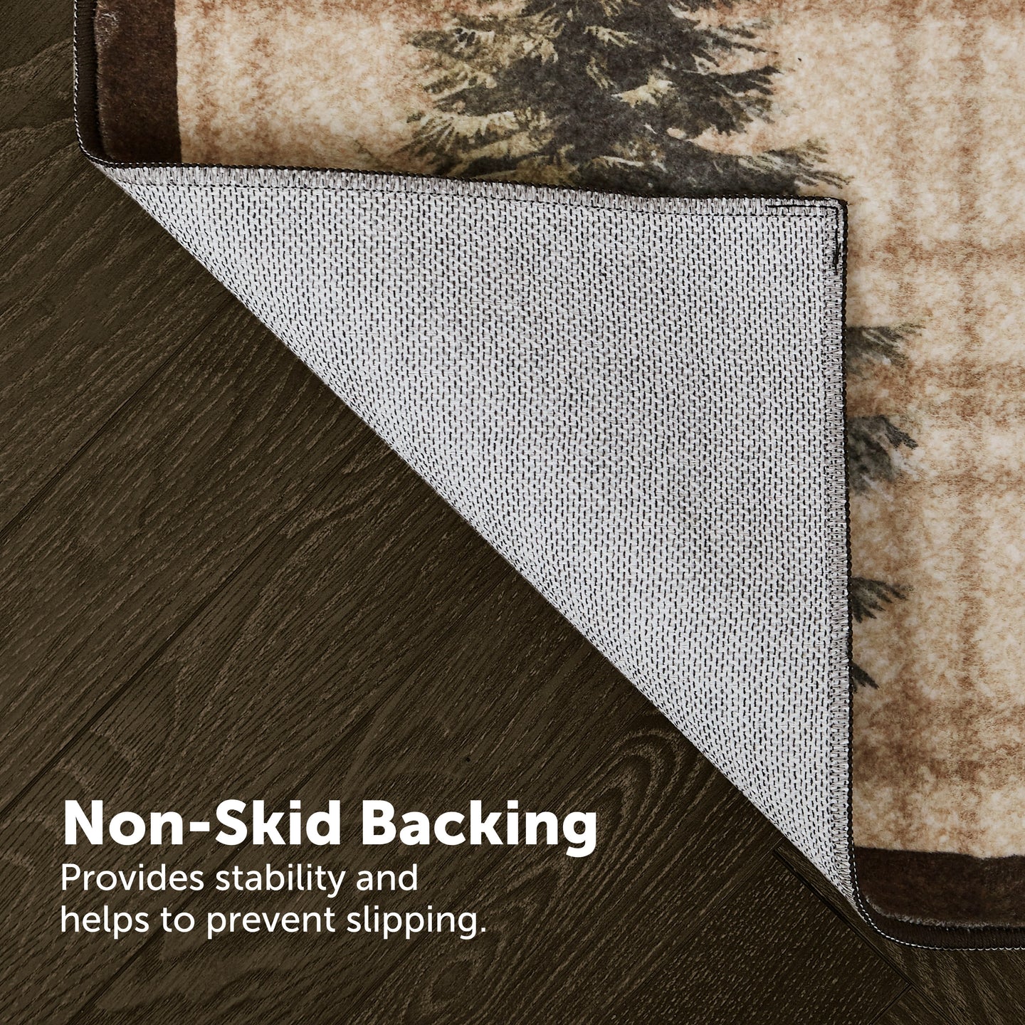 Rug corner revealing white textured non-skid backing beneath beige and dark patterned surface.
