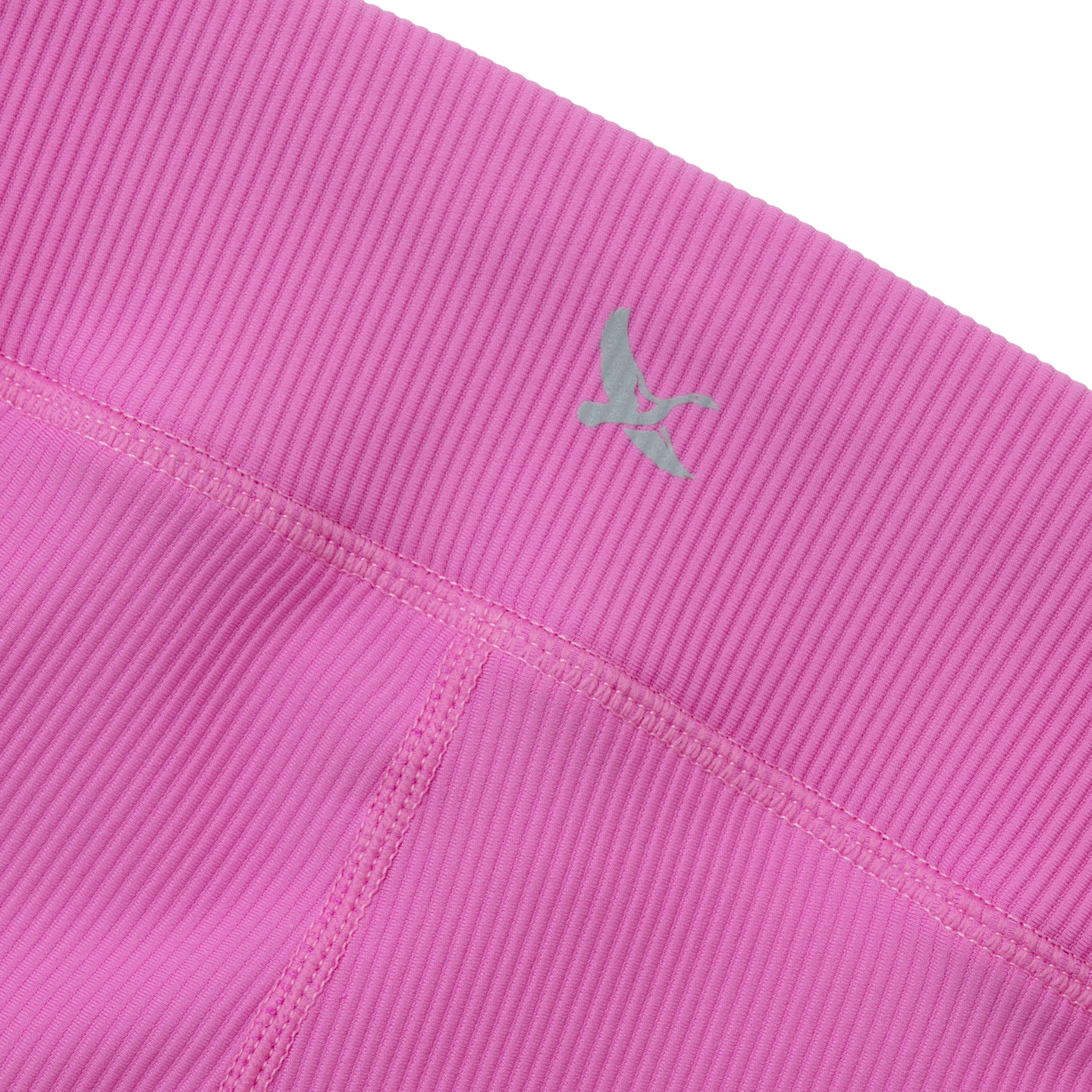 Bright pink ribbed leggings with green logo detail on waistband.