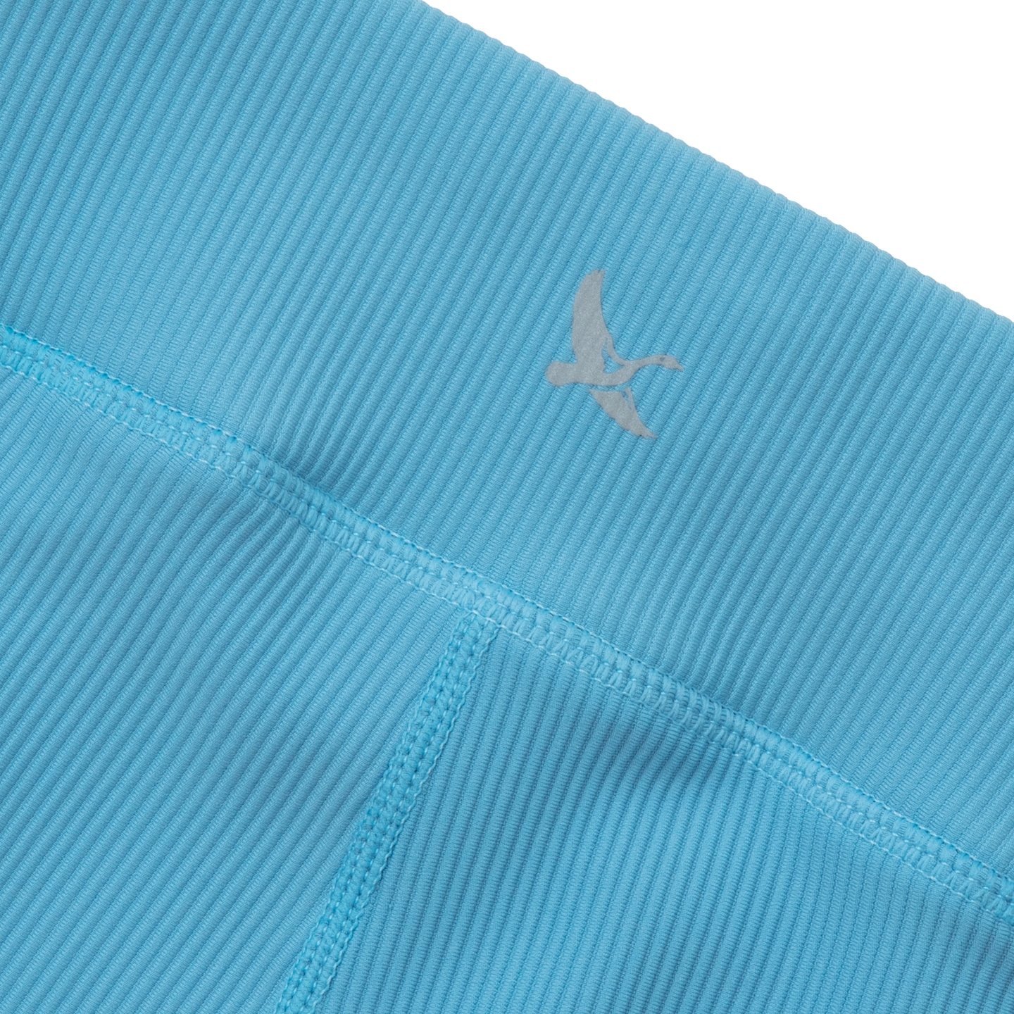 Turquoise ribbed leggings with vertical texture and a gray logo on the waistband.